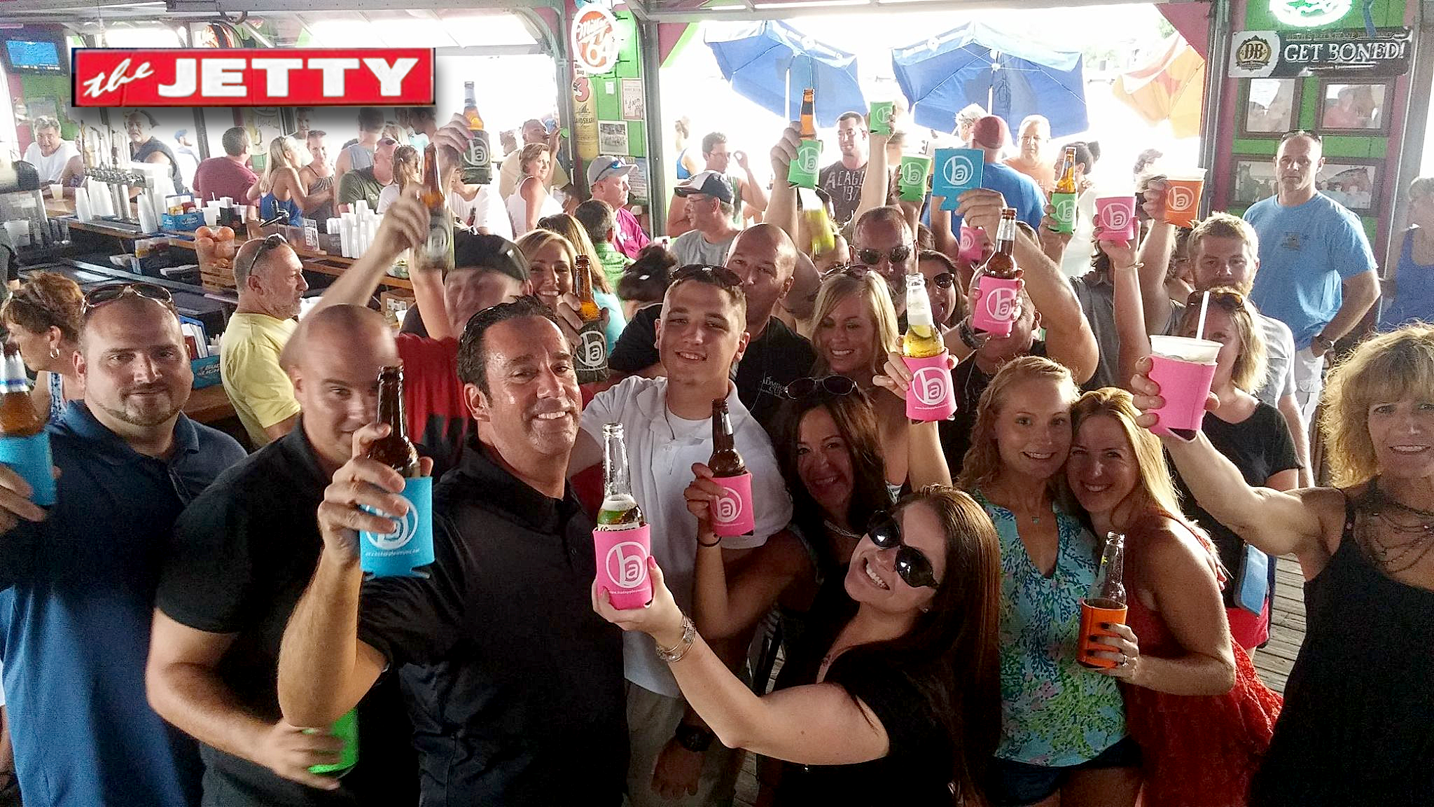 Bad Apples friends and fans showing support with koozies at The Jetty