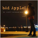 Picture of Bad Apples' album Left Standing; Girl standing alone on streets of Baltimore